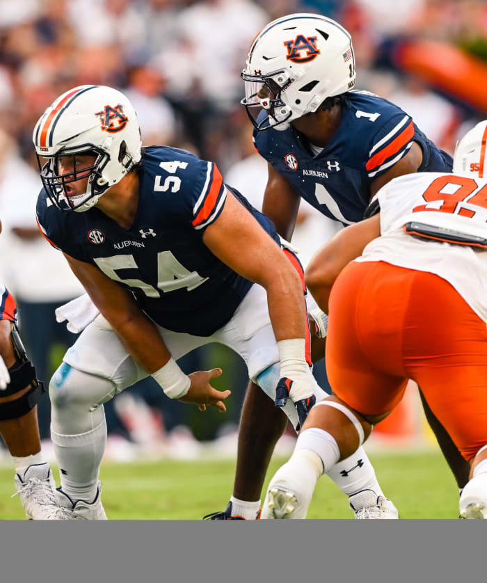 Sep 3, 2022; Auburn, Al, USA; Tate Johnson (54), T.J. Finley (1) receives the hike during the game between Auburn and Mercer at Jordan-Hare Stadium.